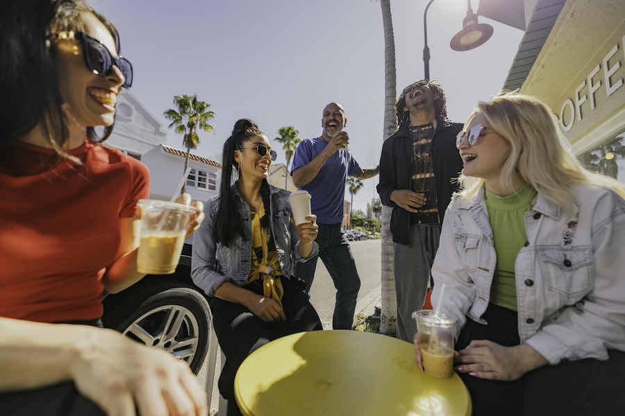 group of friends having coffee in burns court sarasota