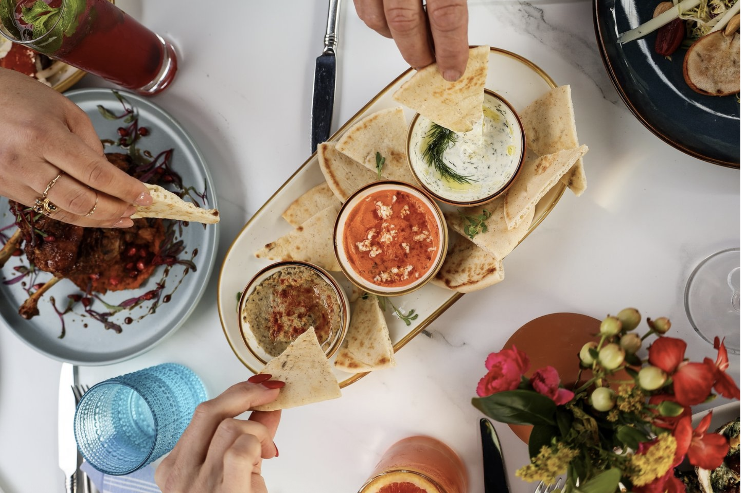 sharing dips at cafe on st armands in sarasota