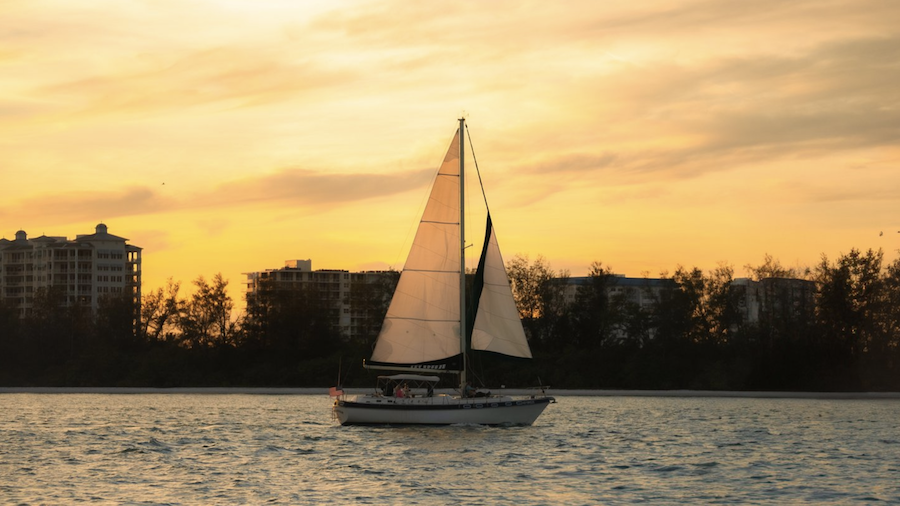 key sailing charters sailboat at sunset in the gulf
