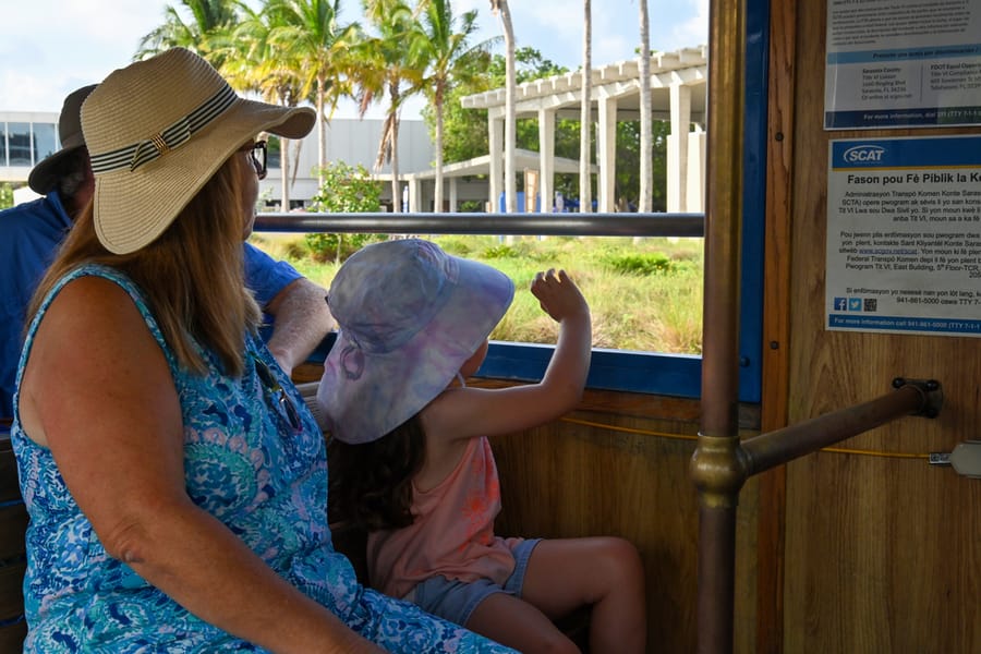 little girl and mom riding the trolley