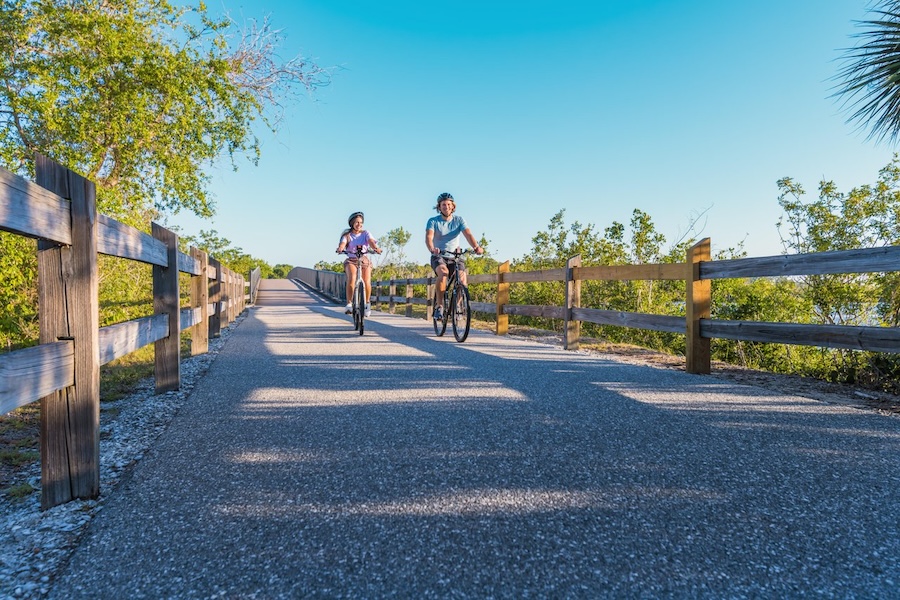 couple of bikers on the legacy trail near pinecraft