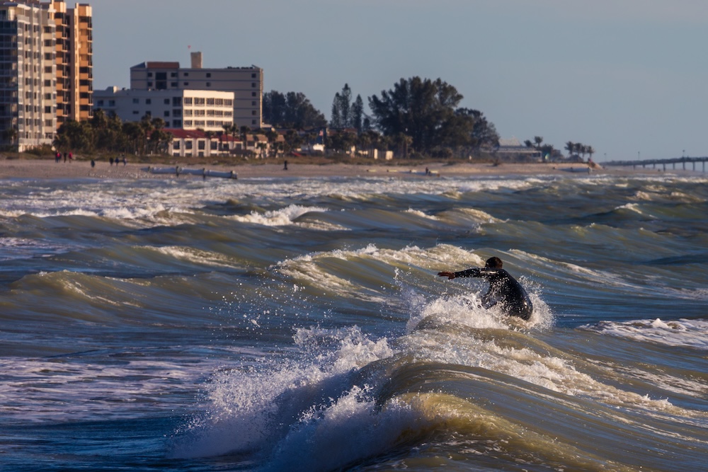 surfer at venice jetty