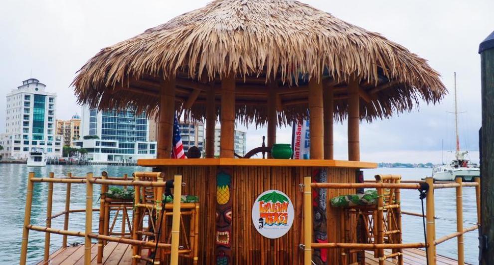 tiki boat flowing in sarasota bay