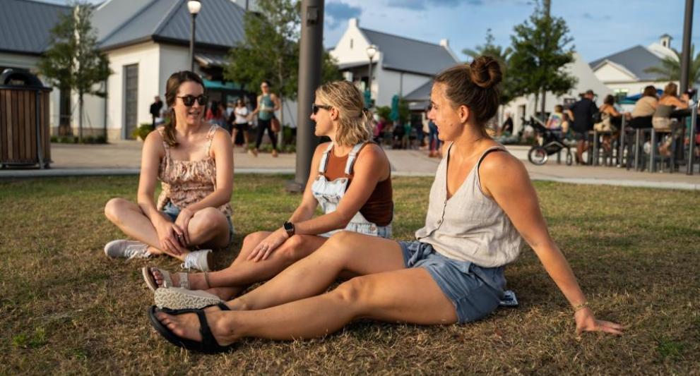 waterside place girls on the grass talking